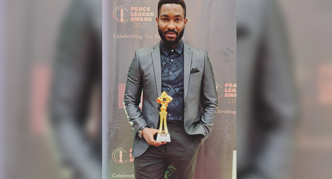 Marketing Communications Manager, Kevin Olumese, with the Award