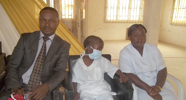 Professor Nosakhare Bazuaye (R) with Ndik Mathew in 2012 after a successful surgery.