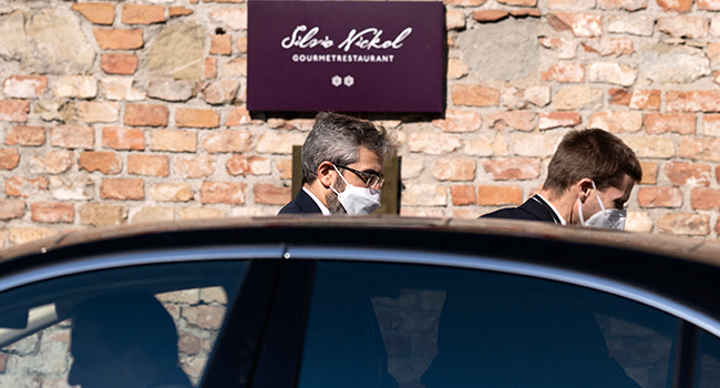 Iran's chief nuclear negotiator Ali Bagheri Kani (C) is leaving the Coburg Palais, the venue of the Joint Comprehensive Plan of Action (JCPOA), after his meeting with Deputy Secretary General of the European External Action Service (EEAS) Enrique Mora (not pictured), in Vienna on March 11, 2022. JOE KLAMAR / AFP