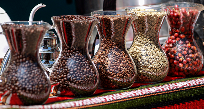 Different kinds of fresh and roasted local coffee grains are displayed during an event in Yemen's capital Sanaa on March 3, 2022, on the occasion of Yemen's "National Coffee Day". MOHAMMED HUWAIS / AFP