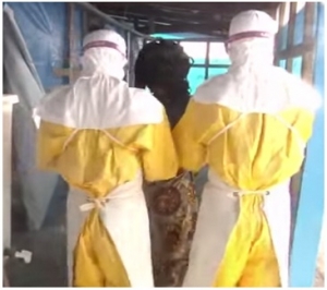 Ebola patient Held By health workers 
