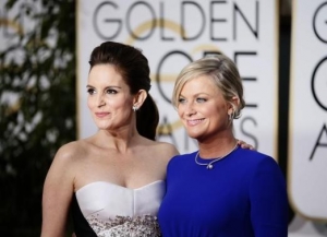 Show hosts Tina Fey and Amy Poehler arrive at the 72nd Golden Globe Awards in Beverly Hills