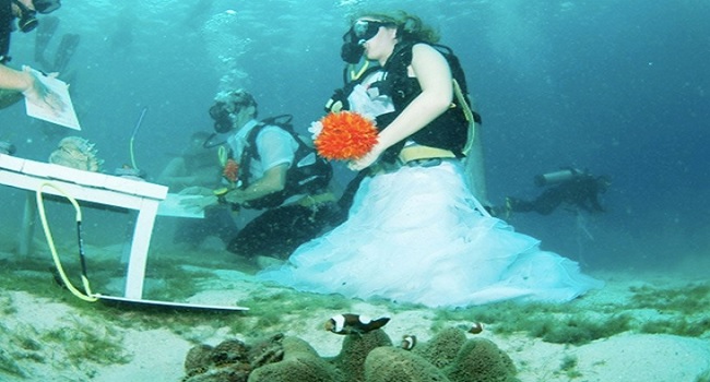 Couple Exchange Vows Underwater