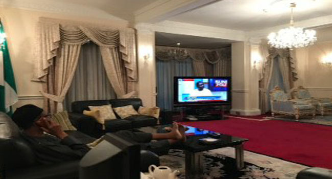 President Buhari watching a programme on Channels TV