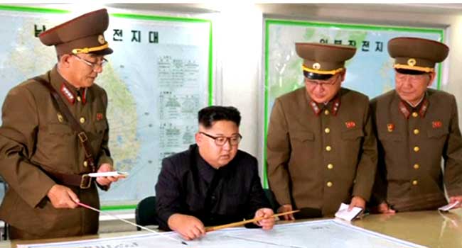 North Korea Releases Photos Of Kim Reviewing Guam Attack Plan