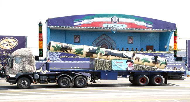 In defiance to US, Iran unveils latest missile during parade