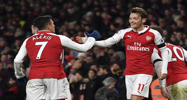 Ozil Stars As Gunners Thrash Huddersfield