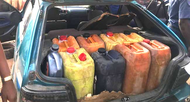 A file photo of petroleum products in plastic kegs.