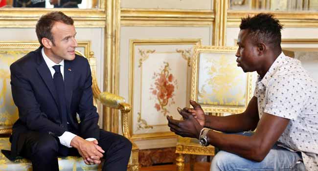 Macron and superman migrant Macron Praises Migrant 'Spiderman' Who Saved Child • Channels Television