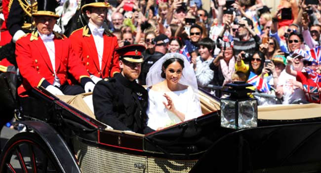 Prince Harry, Meghan Cheered In Horse Drawn Carriage