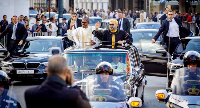President Muhammadu Buhari and King of Morocco, HRM Mohammed VI, wave at the cheering crowd during President Buhari's visit to the Northern African country on Sunday, June 10, 2018.