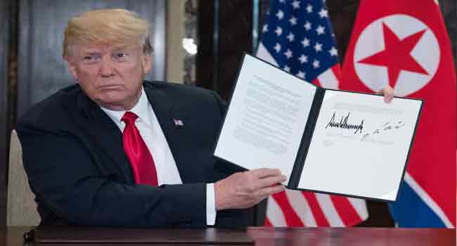 Trump Kim Sign Joint Document Trump Releases 'Very Nice' Letter From Kim Jong Un • Channels Television