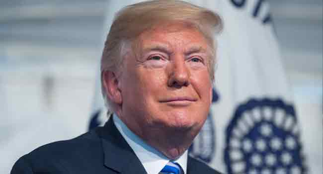 Trump smiles White House Says Trump 'Open' To Visiting Moscow • Channels Television