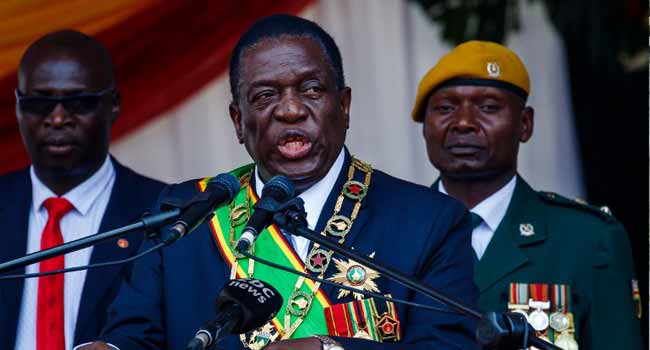 Zimbabwe's President Emmerson Mnangagwa speaks during the Defence Forces Day celebrations held at the National Sports Stadium in Harare on August 14, 2018. Jekesai NJIKIZANA / AFP