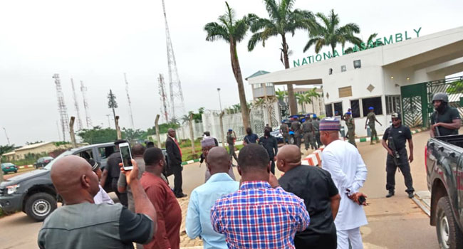 Security agencies barricade entrance of the National Assembly, preventing lawmakers, members of staff of National Assembly, journalists and other persons from entering on Tuesday, August 7, 2018.