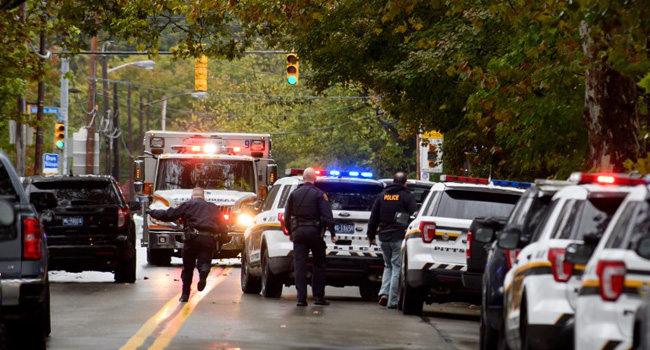 Police cars and ambulances at site of mass shooting at US Synagogue 11 People Killed As Gunman Attacks US Synagogue • Channels Television