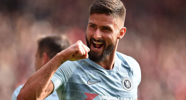 Chelsea's French striker Olivier Giroud celebrates after Chelsea's English midfielder Ross Barkley (unseen) scored his team's second goal during the English Premier League football match between Southampton and Chelsea at St Mary's Stadium in Southampton, southern England on October 7, 2018. 