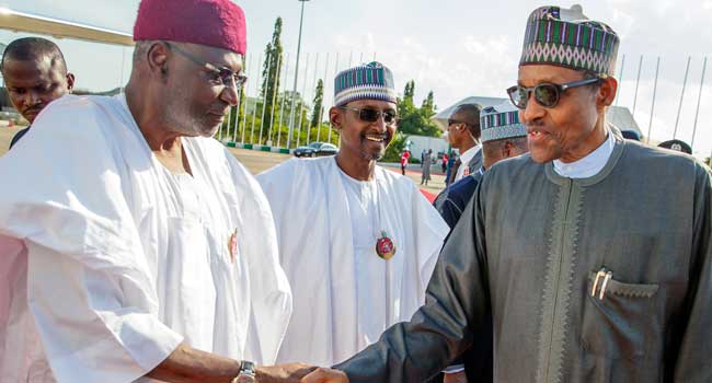 A file photo of President Muhammadu Buhari (R) and his late Chief of Staff, Abba Kyari (L).