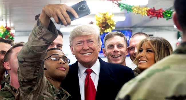 Troops Take Selfies With Trump, Melania In Unannounced Iraq Visit