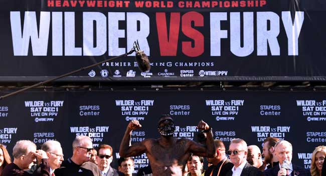 Wilder Vows To Knock Out Fury At Heavyweight Title Weigh-In