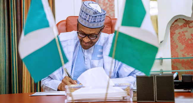 Buhari Signs N30,000 Minimum Wage Bill Into Law