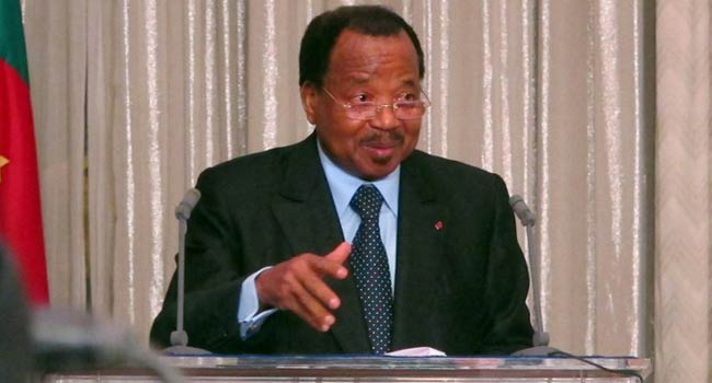 Cameroon President Paul Biya speaks as he meets with French former hostages at the presidential palace in Yaounde on April 19, 2013. AFP PHOTO / REINNIER KAZE