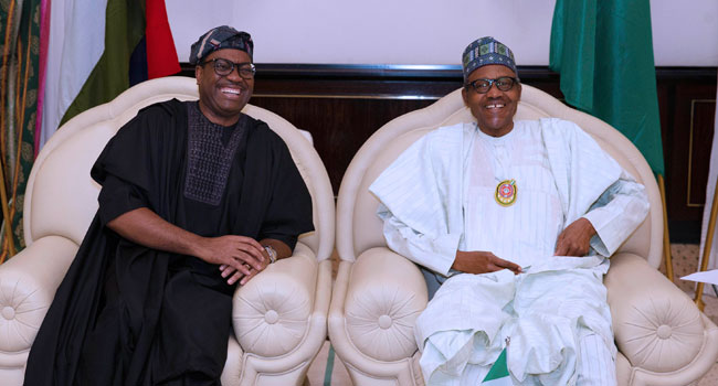 A file photo of AfDB President, Akinwumi Adesina and President Muhammadu Buhari.