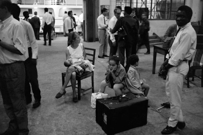 In this file photograph taken on July 24, 1967, European families wait for their evacuation by boat, in Port Harcourt, during the Biafran war. Colin HAYNES / AFP