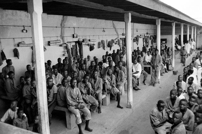  In this file photograph taken on November 1, 1967, Biafran prisoners and civilians wait at the federal camp of Nakurdi, a converted outdoor movie theatre in Enugu, after fighting between Nigerian federal army troops and the Biafran rebels, during the Biafran war. Colin HAYNES / AFP