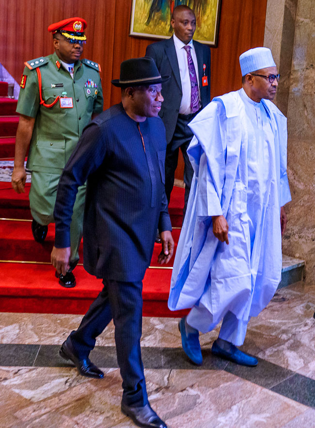 A file photo of former President Goodluck Jonathan and President Muhammadu Buhari.