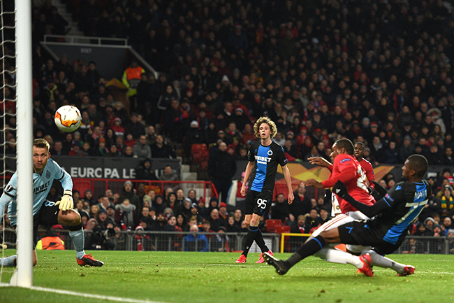 Manchester United's Nigerian striker Odion Ighalo (R) scores his team's second goal during the UEFA Europa League round of 32 second leg football match between Manchester United and Club Brugge at Old Trafford in Manchester, north west England, on February 27, 2020. Photo: Oli SCARFF / AFP