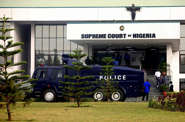 A police truck is stationed at the entrance of Supreme Court of Nigeria in Abuja during the review of Bayelsa APC's governorship candidate David Lyon over the Bayelsa Election. Photo: Sodiq Adelakun/Channels TV
