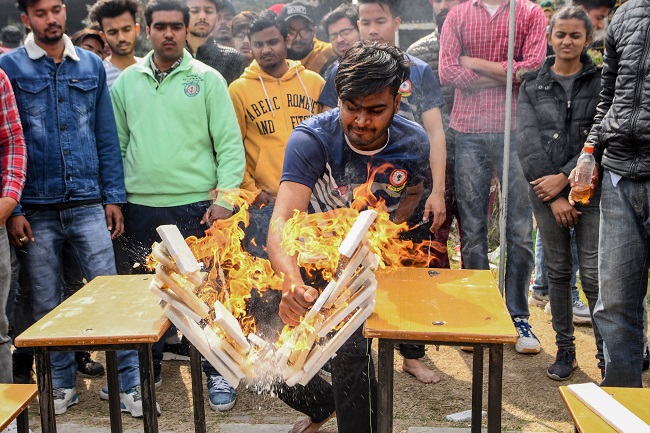 A student demonstrates his karate skills during the annual sports meeting at Shahzada Nand College ground in Amritsar on February 19, 2020. (Photo by NARINDER NANU / AFP)