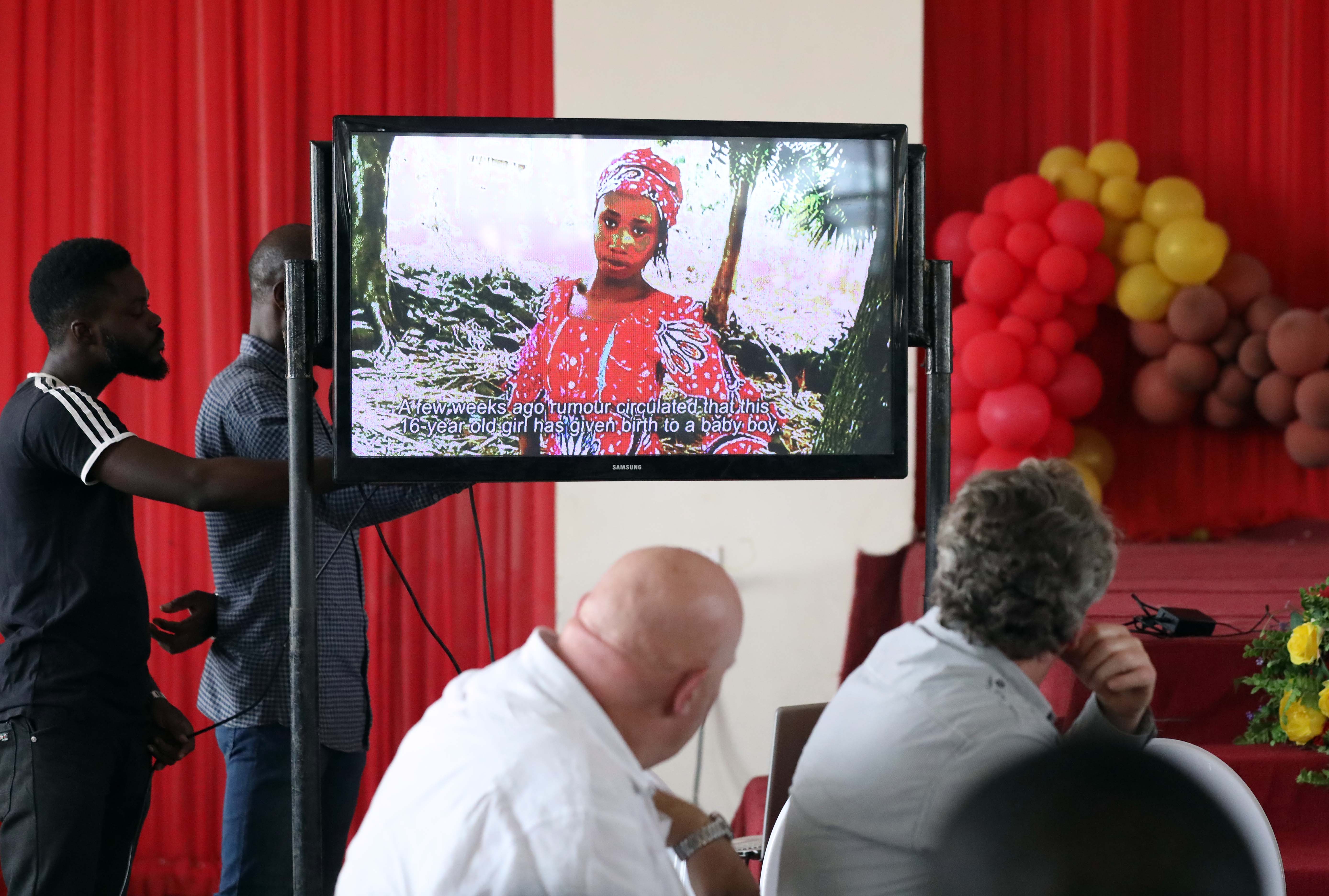 People look at a documentary of Leah Sharibu during her 2nd year in captivity remembrance in Abuja. PHOTO: Sodiq Adelakun