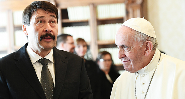 Hungarian President Janos Ader (L) gestures as he meets with Pope Francis during a private audience at the Vatican, on February 14, 2020. Vincenzo PINTO / POOL / AFP