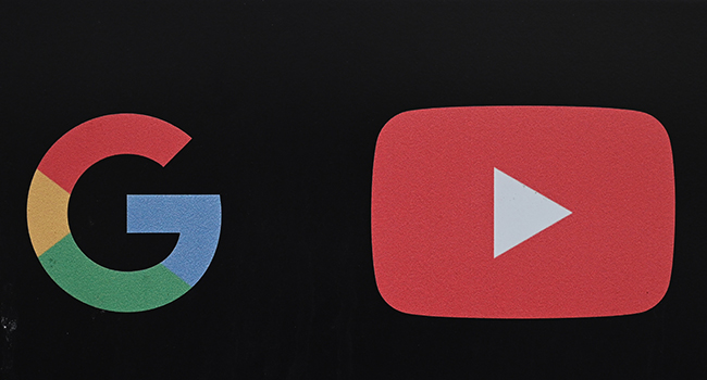 In this file photo taken on November 21, 2019, the Google and YouTube logos are seen at the entrance to the Google offices in Los Angeles, California. Alphabet is the parent company of Google and Youtube. Robyn Beck / AFP