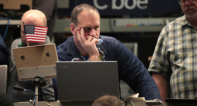 Traders work in the S&P options pit near the close of trading on the Cboe Global Markets trading floor on January 31, 2020 in Chicago, Illinois. Scott Olson/Getty Images/AFP