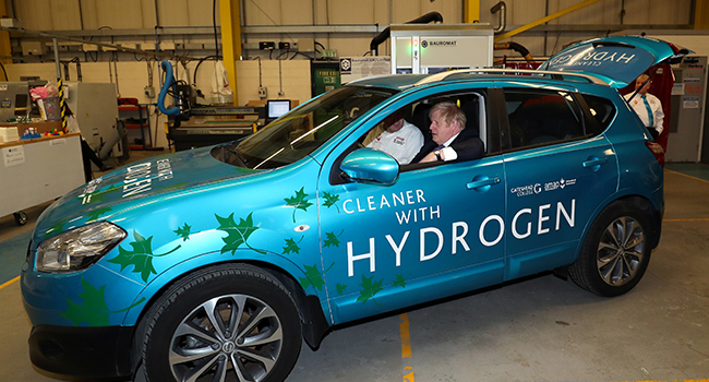 Britain's Prime Minister Boris Johnson sits in a hydrogen-fuelled prototype car during a visit to The Industry Centre at the University of Sunderland in Sunderland, northeast England, on January 31, 2020. SCOTT HEPPELL / POOL / AFP