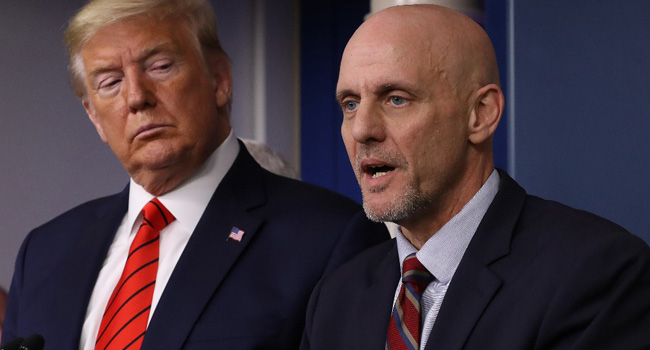 US President Donald Trump listens to FDA Commissioner Stephen Hahn (R) speak on the latest developments of the coronavirus outbreak, in the James Brady Press Briefing Room at the White House March 19, 2020 in Washington, DC. Brendan Smialowski / AFP