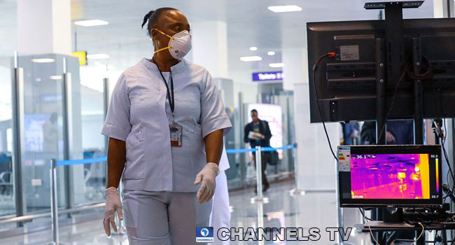 A woman wears a mask at a Nigerian airport amid the coronavirus outbreak in the country.