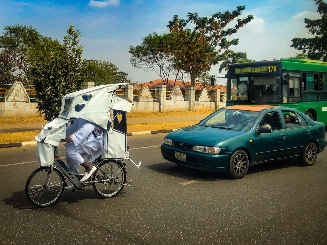 A motorcycle rider is seen on Muhammadu Buhari way, in Abuja on March 6, 2020. Photo: Sodiq Adelakun/ Channels TV