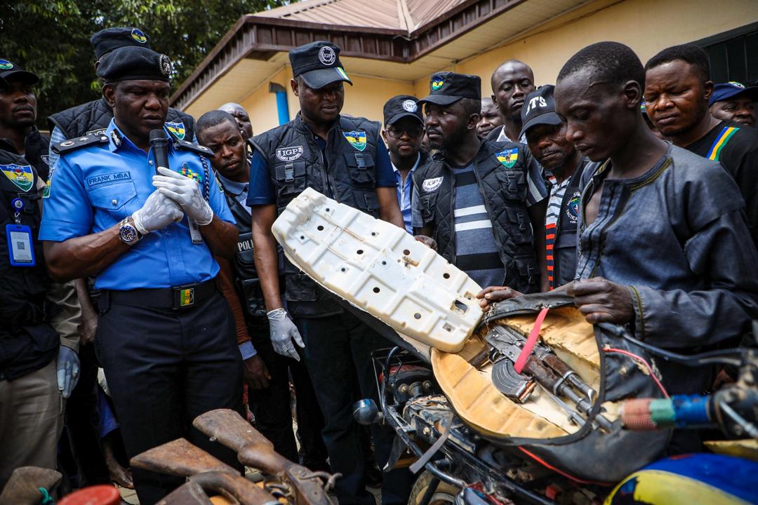 A kidnapper displays how he hide guns in a car during the parade of suspects by the Special Anti-Robbery Squad of the Nigerian Police Force in Abuja on March 11th, 2020. Photo: Sodiq Adelakun / Channels TV