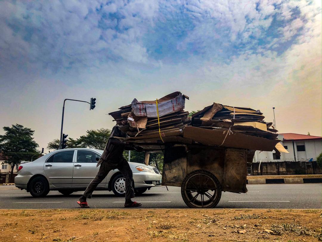 A man pushes a makeshift waste disposal at the Central Area in Abuja on March 11, 2020. Photo: Sodiq Adelakun / Channels TV