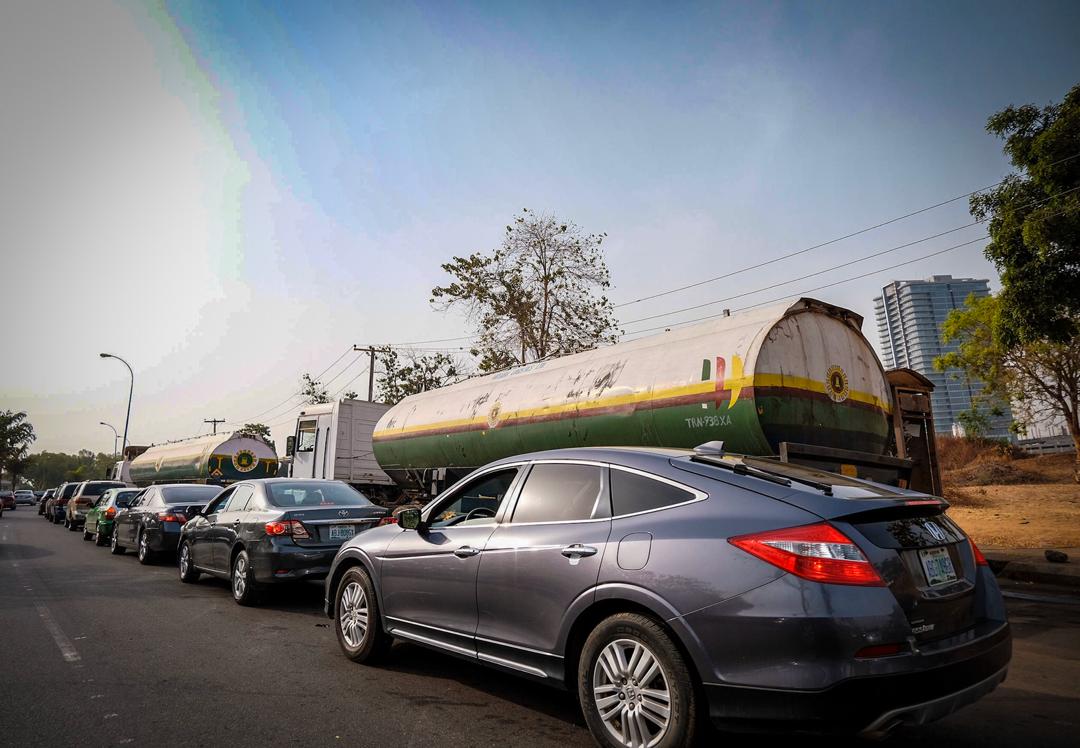 Motorist queue for fuel after the reduction of PMS to N125 per litre in Abuja on Friday, March 20th, 2020. Photos: Sodiq Adelakun / Channels TV