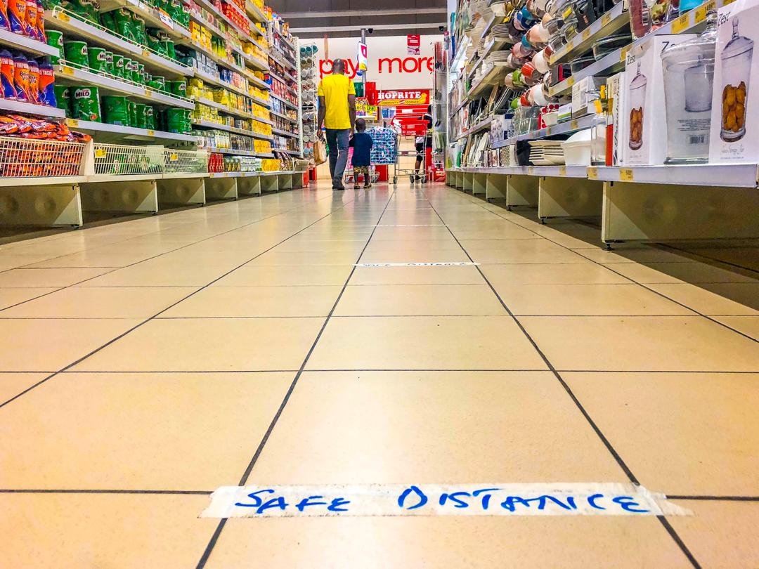 A ‘safe distance’ tag is placed on the floor of a store in Abuja as a safety measure in helping to curb the spread of the new coronavirus on Wednesday, March 25, 2020. Channels Television / Sodiq Adelakun.