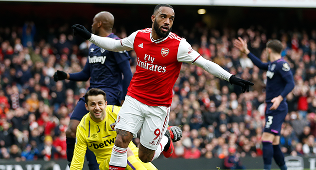 Arsenal's French striker Alexandre Lacazette celebrates after scoring the opening goal of the English Premier League football match between Arsenal and West Ham at the Emirates Stadium in London on March 7, 2020. Ian KINGTON / AFP