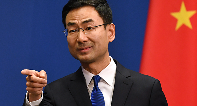 Chinese Foreign Ministry spokesman Geng Shuang takes a question during the daily press briefing in Beijing on March 18, 2020. GREG BAKER / AFP