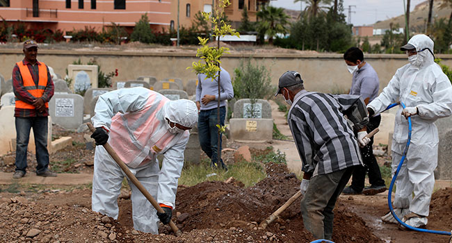 A picture taken on March 25, 2020, shows the burial of a victim of the COVID-19 coronavirus in the Moroccan city of Marrakech. AFP