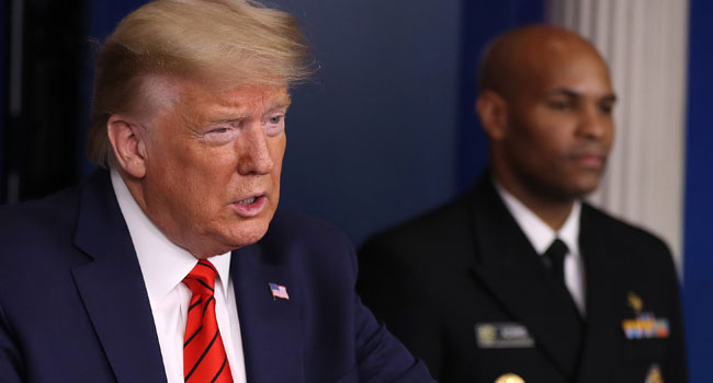 President Donald Trump speaks speaks on the latest developments of the coronavirus outbreak, while flanked by U.S. Surgeon General Jerome Adams, in the James Brady Press Briefing Room at the White House March 19, 2020 in Washington, DC. Chip Somodevilla/Getty Images/AFP