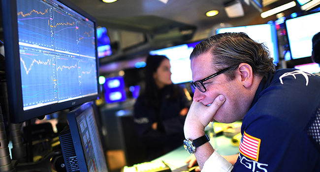 Traders work during the opening bell at the New York Stock Exchange (NYSE) on March 5, 2020 at Wall Street in New York City. Johannes EISELE / AFP